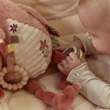 Peluche d’activités flamant rose Safari Friends avec textures, anneau de dentition et perles sonores. Idéale dès la naissance. LITTLE DUTCH